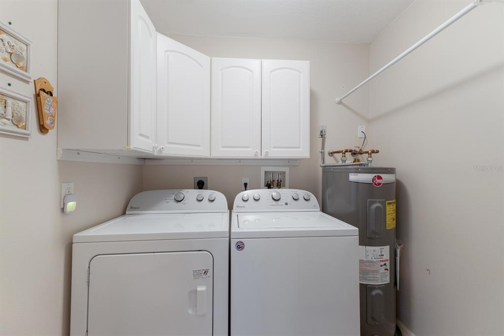 8414 Wethersfield Run, Unit 102 Lakewood Ranch, FL 34202 - Photo 29 of 48 a utility room with dryer and washer