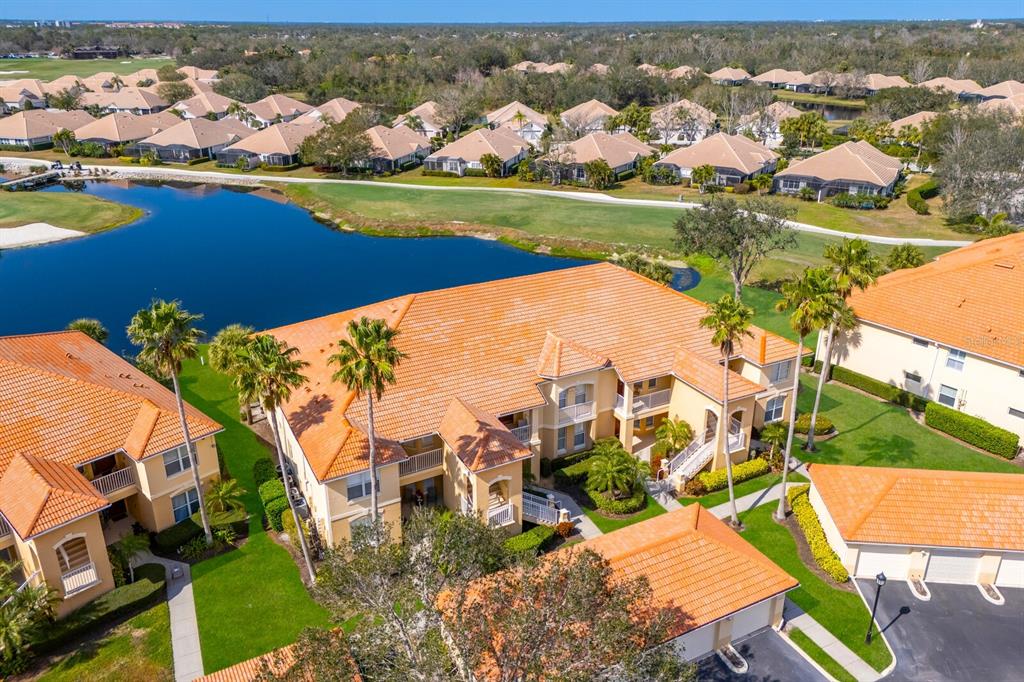 8414 Wethersfield Run, Unit 102 Lakewood Ranch, FL 34202 - Photo 31 of 48 an aerial view of residential houses with outdoor space