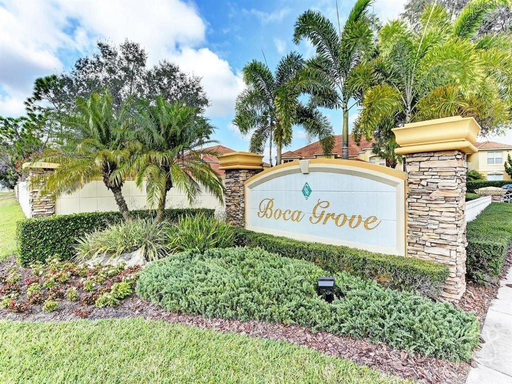 8414 Wethersfield Run, Unit 102 Lakewood Ranch, FL 34202 - Photo 38 of 48 a sign broad in front of flowers