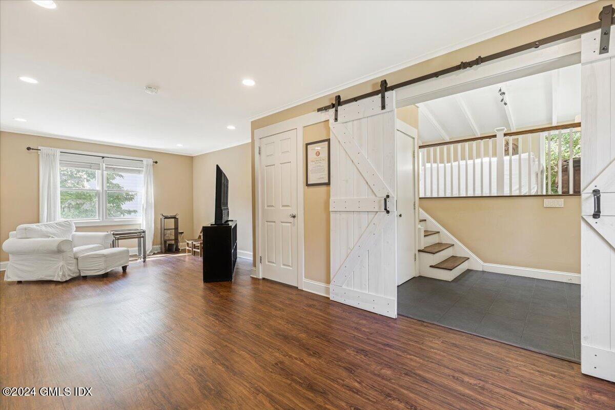 70 Gregory Road Cos Cob, CT 06807 - Photo 21 of 39 a view of an empty room with wooden floor and a window