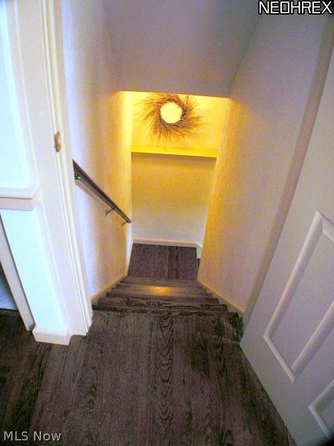 13405 Butler Road Wakeman, OH 44889 - Photo 8 of 25 View of the basement stairwell. The 3rd bedroom is located in the walk out basement. There is one bedroom on each floor in this uniquely styled farm house.