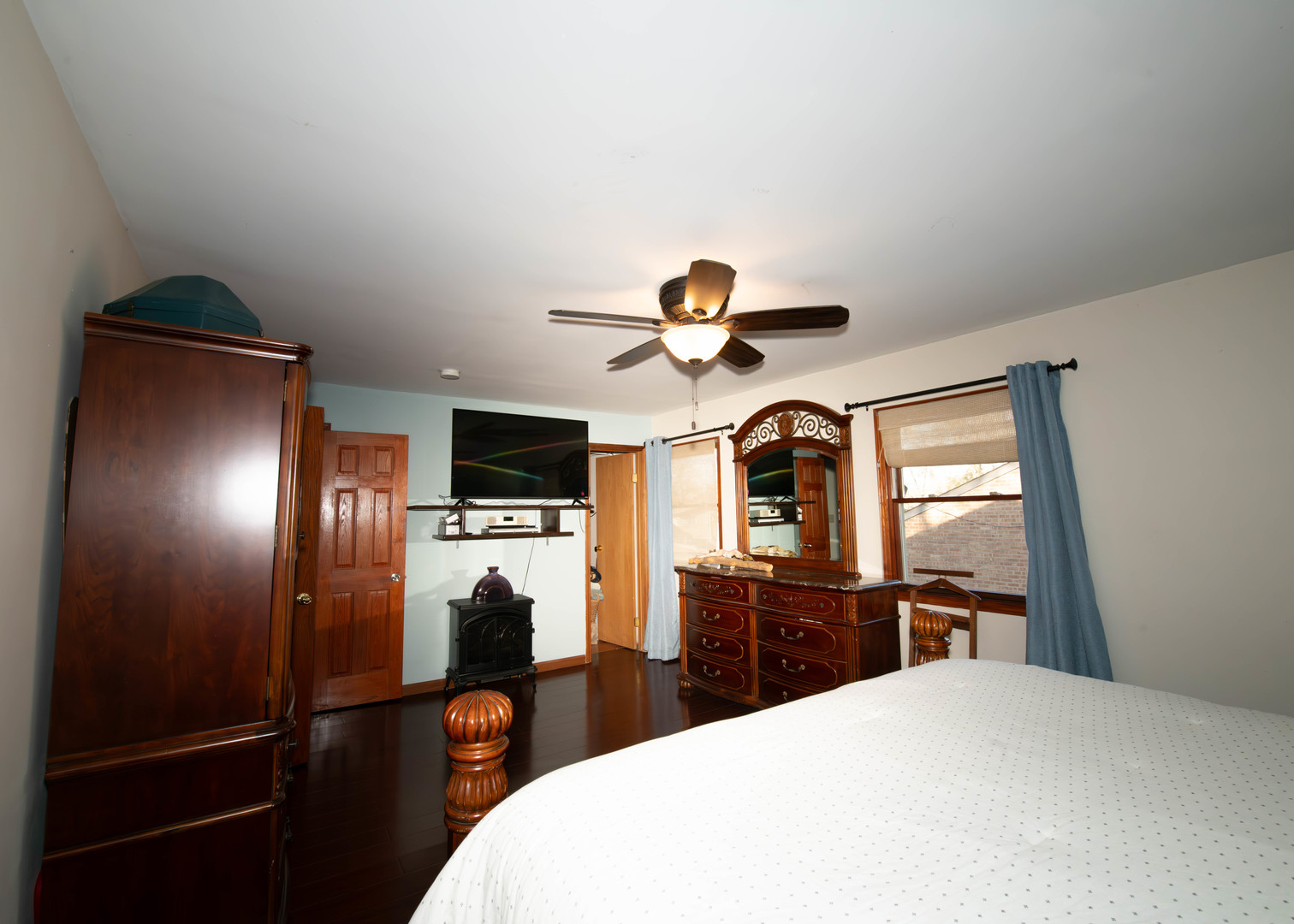185 South Pinecrest Road Bolingbrook, IL 60440 - Photo 19 of 38 a bedroom with a bed and a flat tv screen on dresser