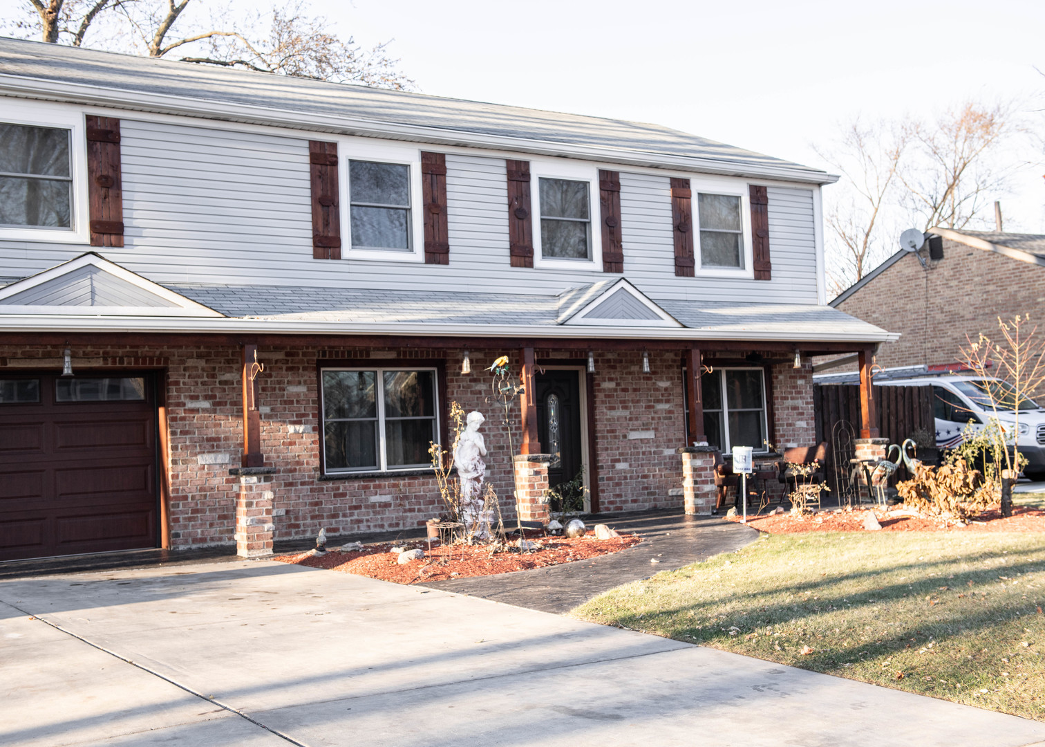 185 South Pinecrest Road Bolingbrook, IL 60440 - Photo 2 of 38 a front view of a brick house with a outdoor space