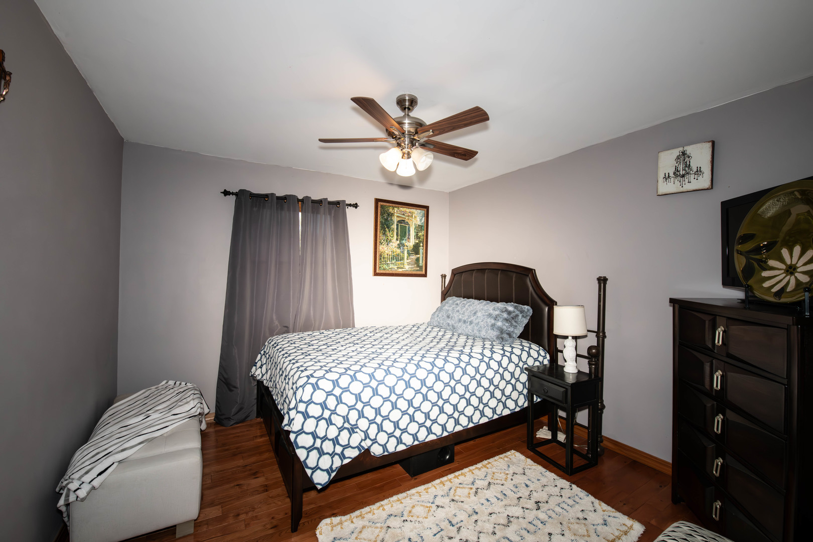 185 South Pinecrest Road Bolingbrook, IL 60440 - Photo 22 of 38 a bedroom with a bed and a chandelier