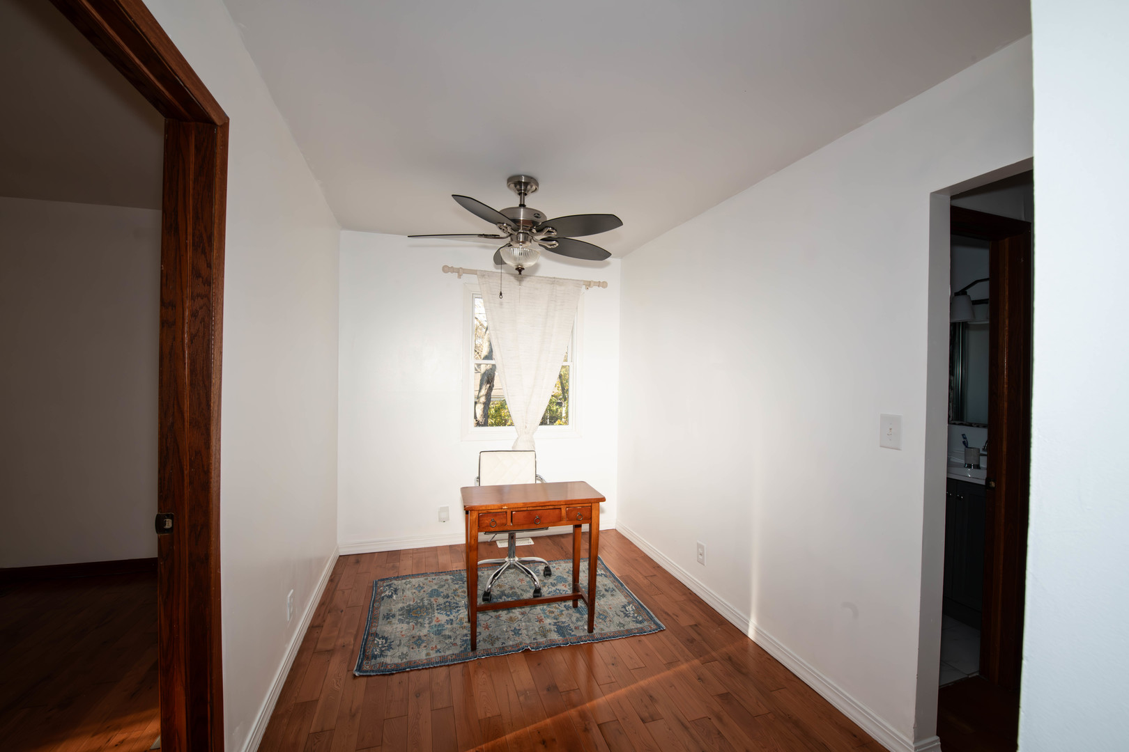 185 South Pinecrest Road Bolingbrook, IL 60440 - Photo 24 of 38 a view of a hallway with wooden floor and a dining room