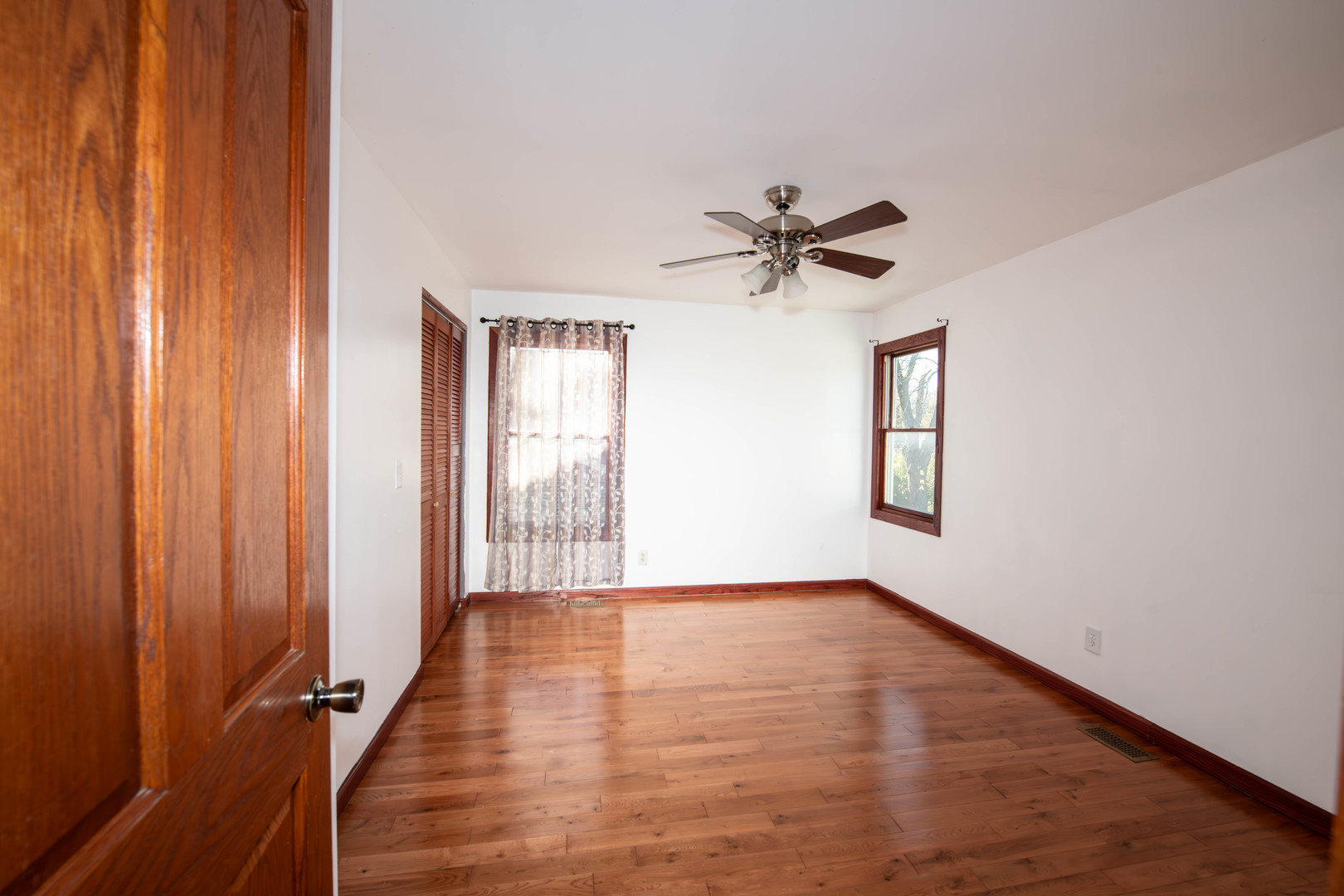 185 South Pinecrest Road Bolingbrook, IL 60440 - Photo 25 of 38 wooden floor in an empty room with a window