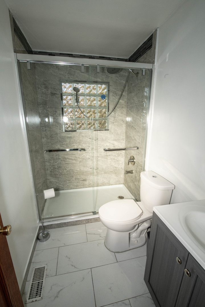 185 South Pinecrest Road Bolingbrook, IL 60440 - Photo 29 of 38 a bathroom with a toilet and a shower