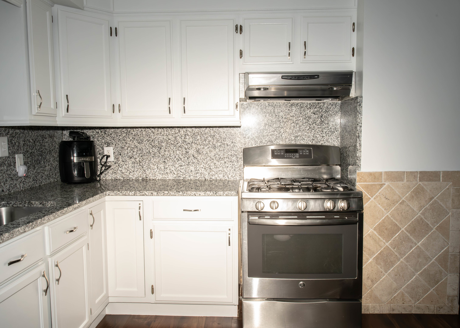 185 South Pinecrest Road Bolingbrook, IL 60440 - Photo 9 of 38 a kitchen with granite countertop white cabinets and stainless steel appliances