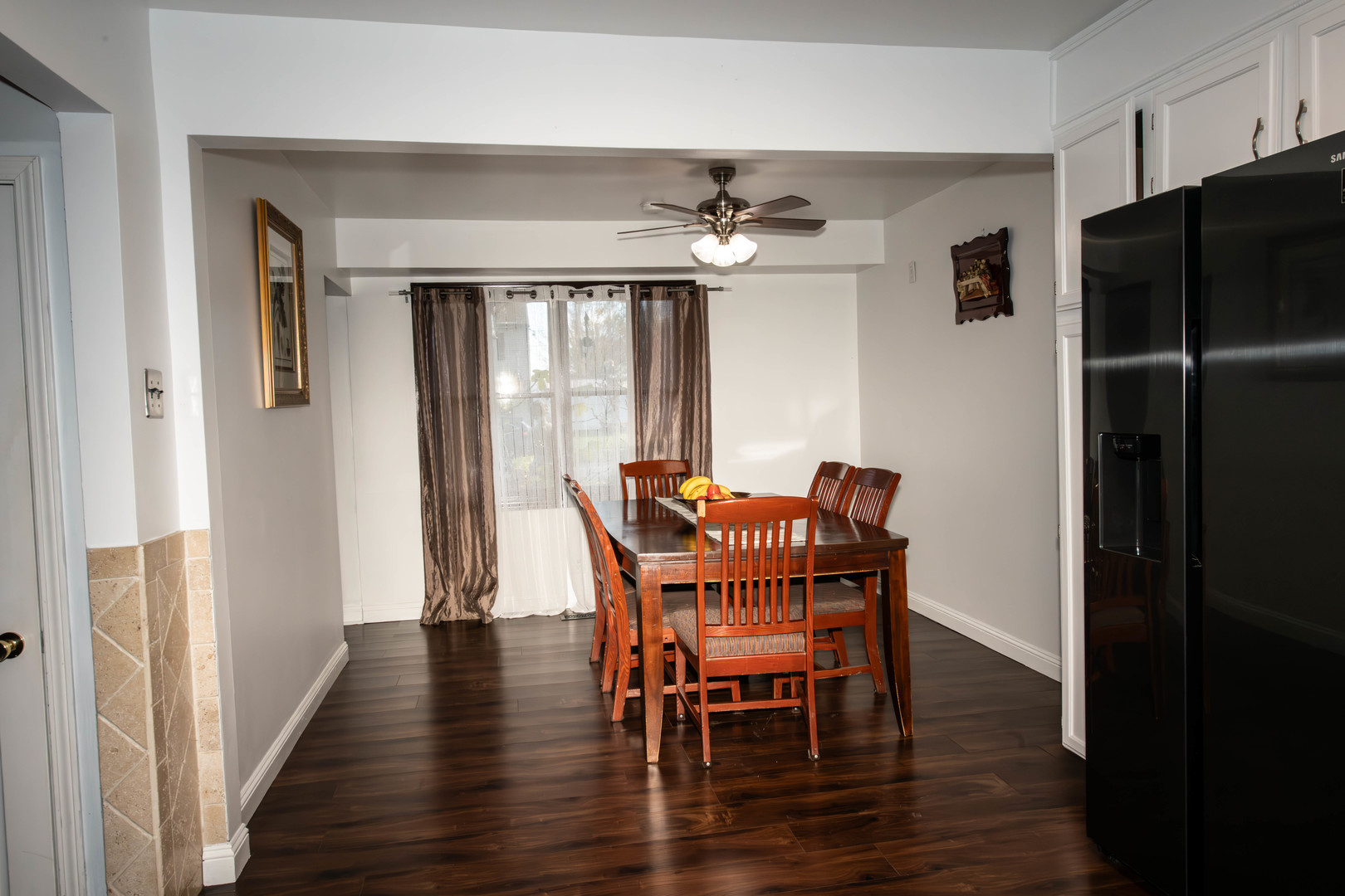 185 South Pinecrest Road Bolingbrook, IL 60440 - Photo 10 of 38 a view of a dining room with furniture window and wooden floor