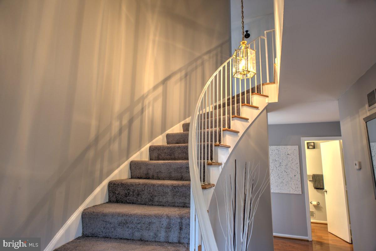 8247 Carrleigh Parkway Springfield, VA 22152 - Photo 5 of 87 Staircase leading towards upper level (3 bedrooms)