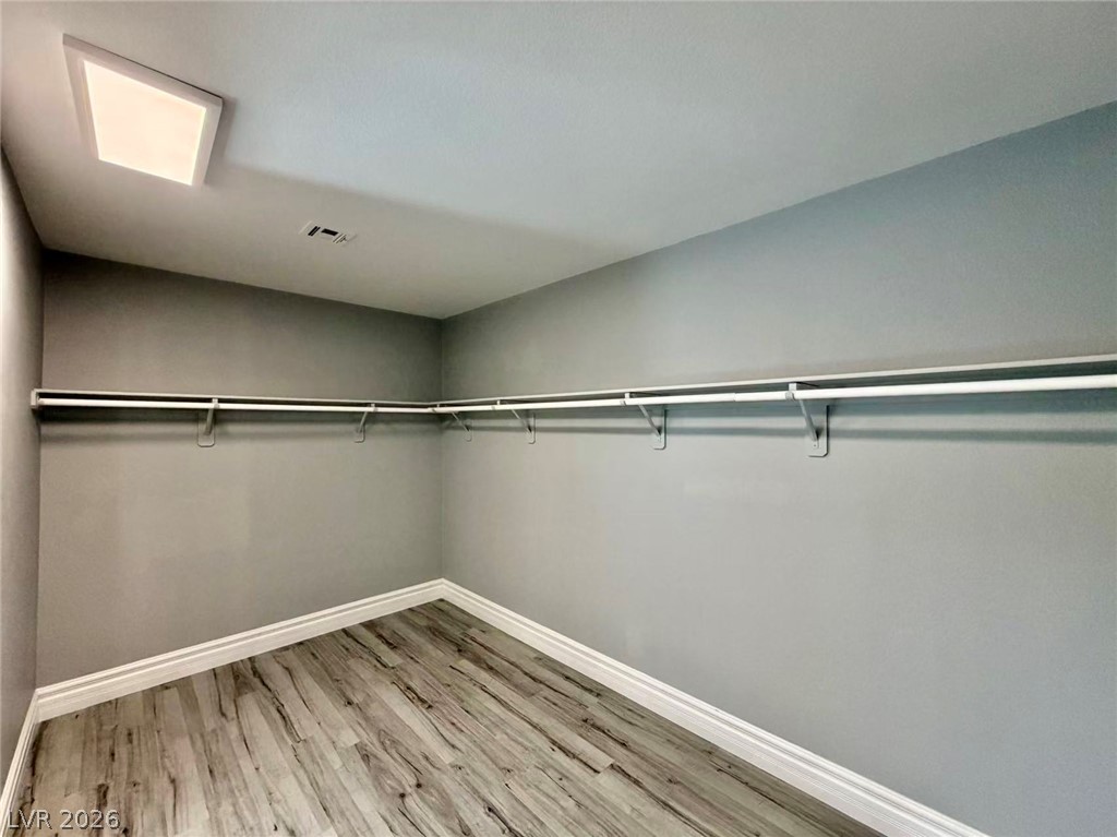 135 Tall Ruff Drive Las Vegas, NV 89148 - Photo 18 of 29 A generously sized walk-in closet with ample storage solutions and durable flooring.
