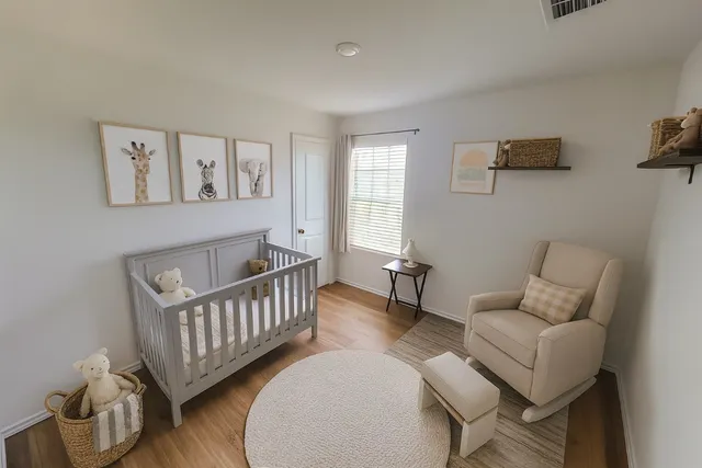 a bed sitting in a room next to a window