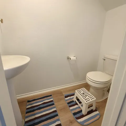 a kitchen with stainless steel appliances a microwave a sink a refrigerator and cabinets