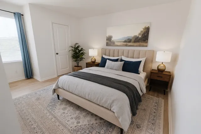 a kitchen with wooden floors and wooden cabinets