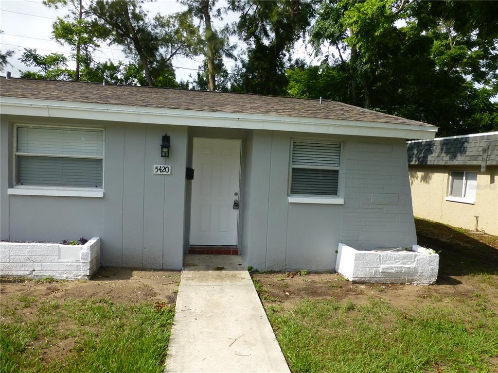 5420 Reef Drive New Port Richey, FL 34652 - Photo 3 of 14 a front view of a house