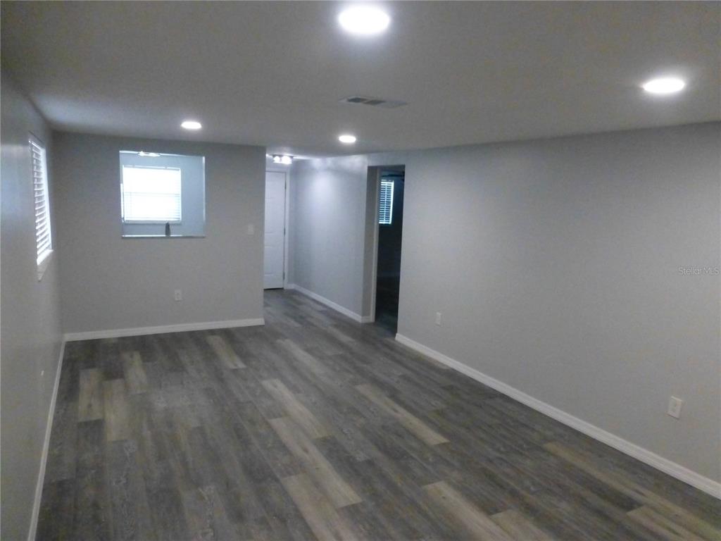5420 Reef Drive New Port Richey, FL 34652 - Photo 7 of 14 a view of empty room with wooden floor