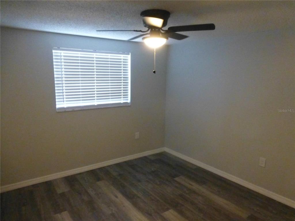 5420 Reef Drive New Port Richey, FL 34652 - Photo 9 of 14 an empty room with a window