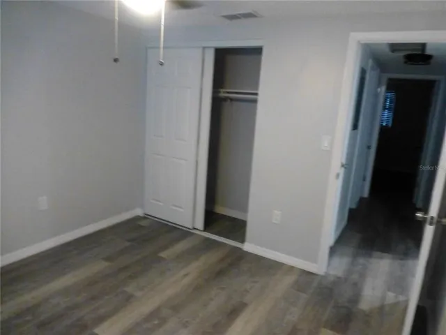 a white toilet sitting next to a bath tub