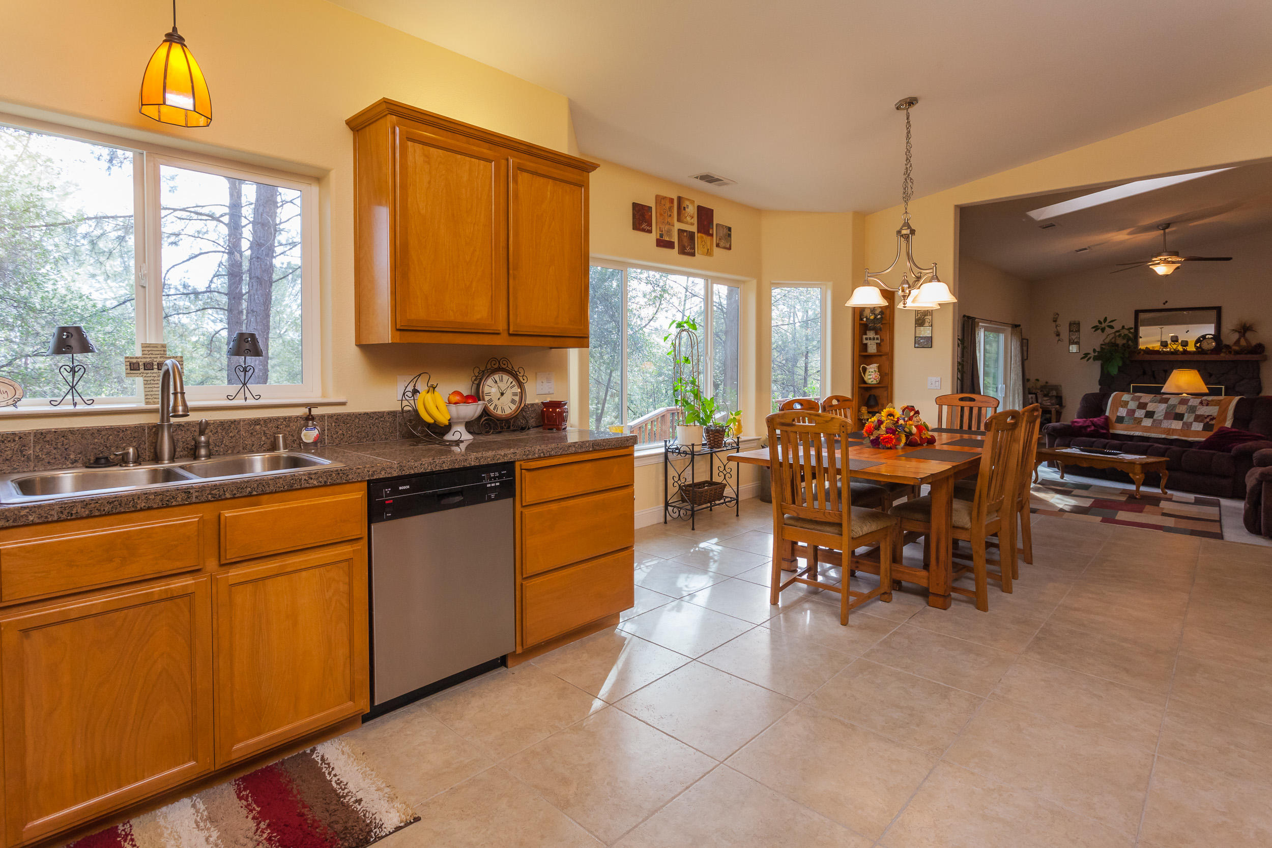 12199 Macs Road Redding, CA 96003 - Photo 12 of 36 a kitchen filled with a large window appliances and furniture