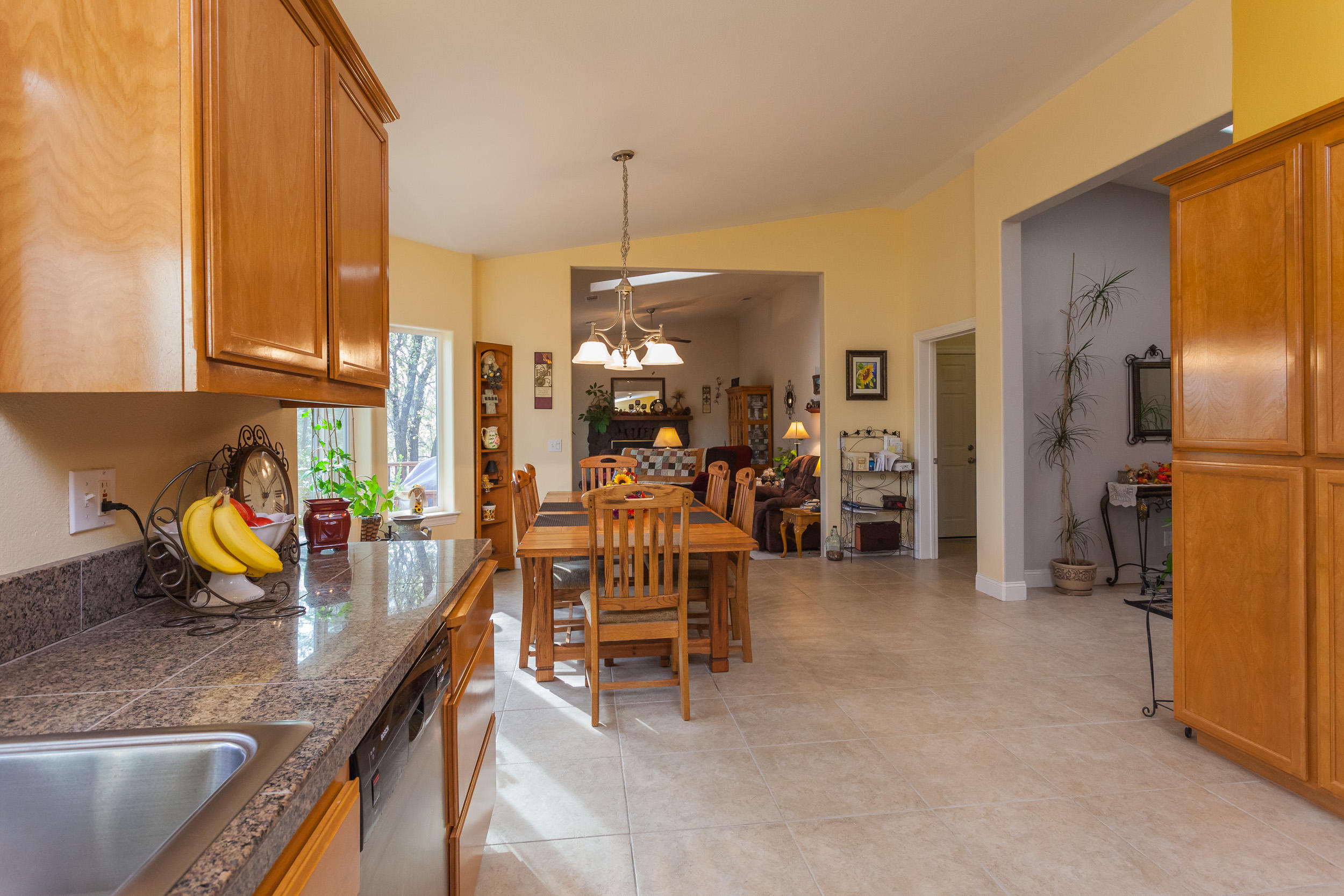 12199 Macs Road Redding, CA 96003 - Photo 13 of 36 a view of a kitchen with furniture and a kitchen