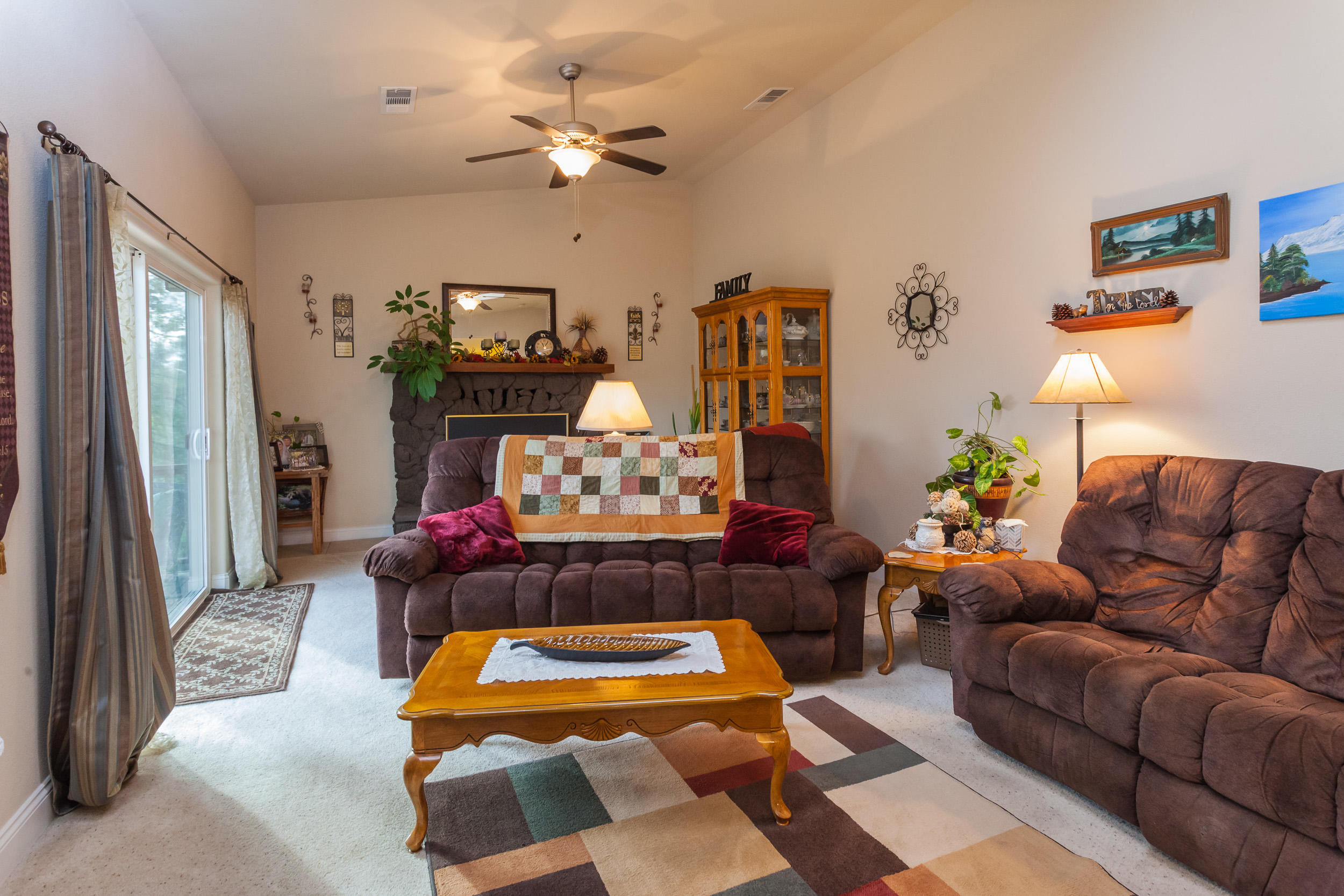 12199 Macs Road Redding, CA 96003 - Photo 14 of 36 a living room with furniture and wooden floor