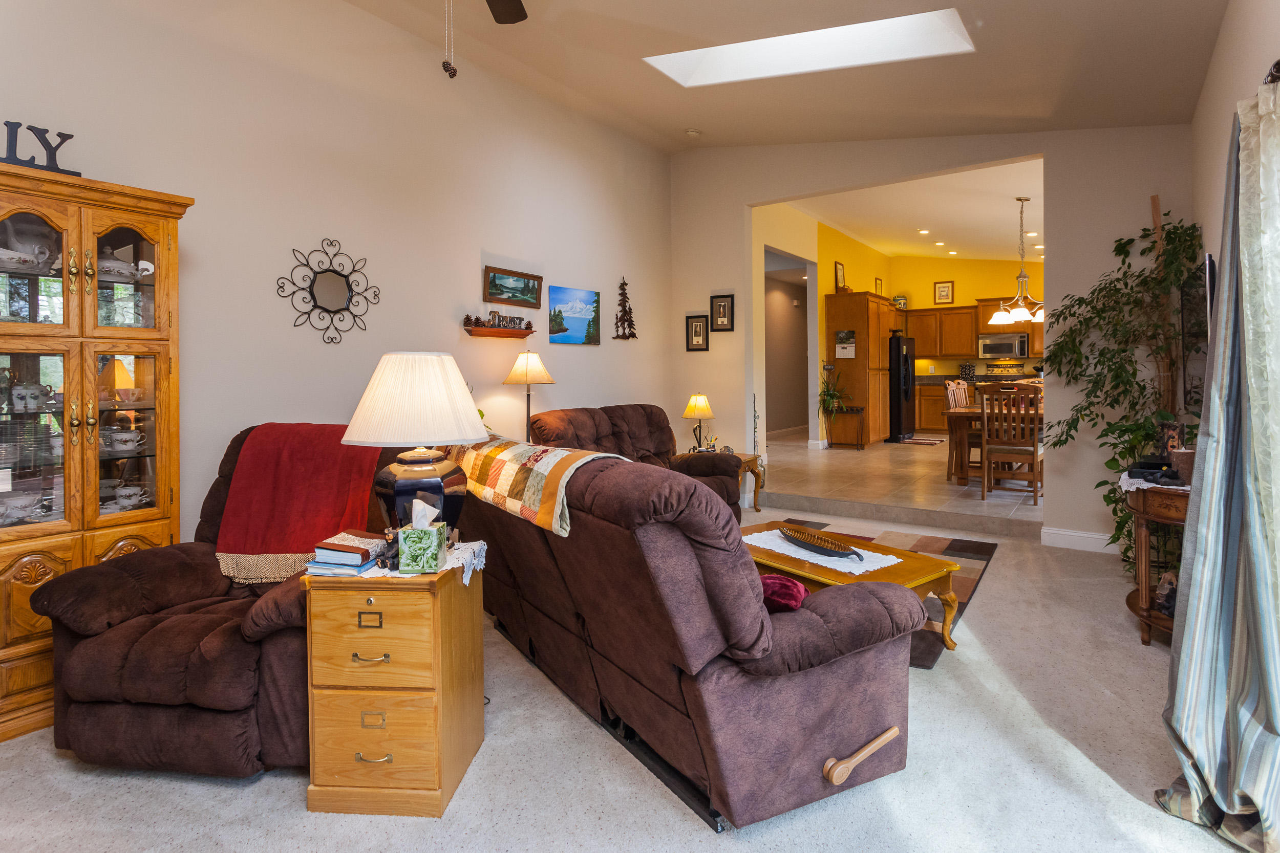 12199 Macs Road Redding, CA 96003 - Photo 16 of 36 a living room with furniture and a large window