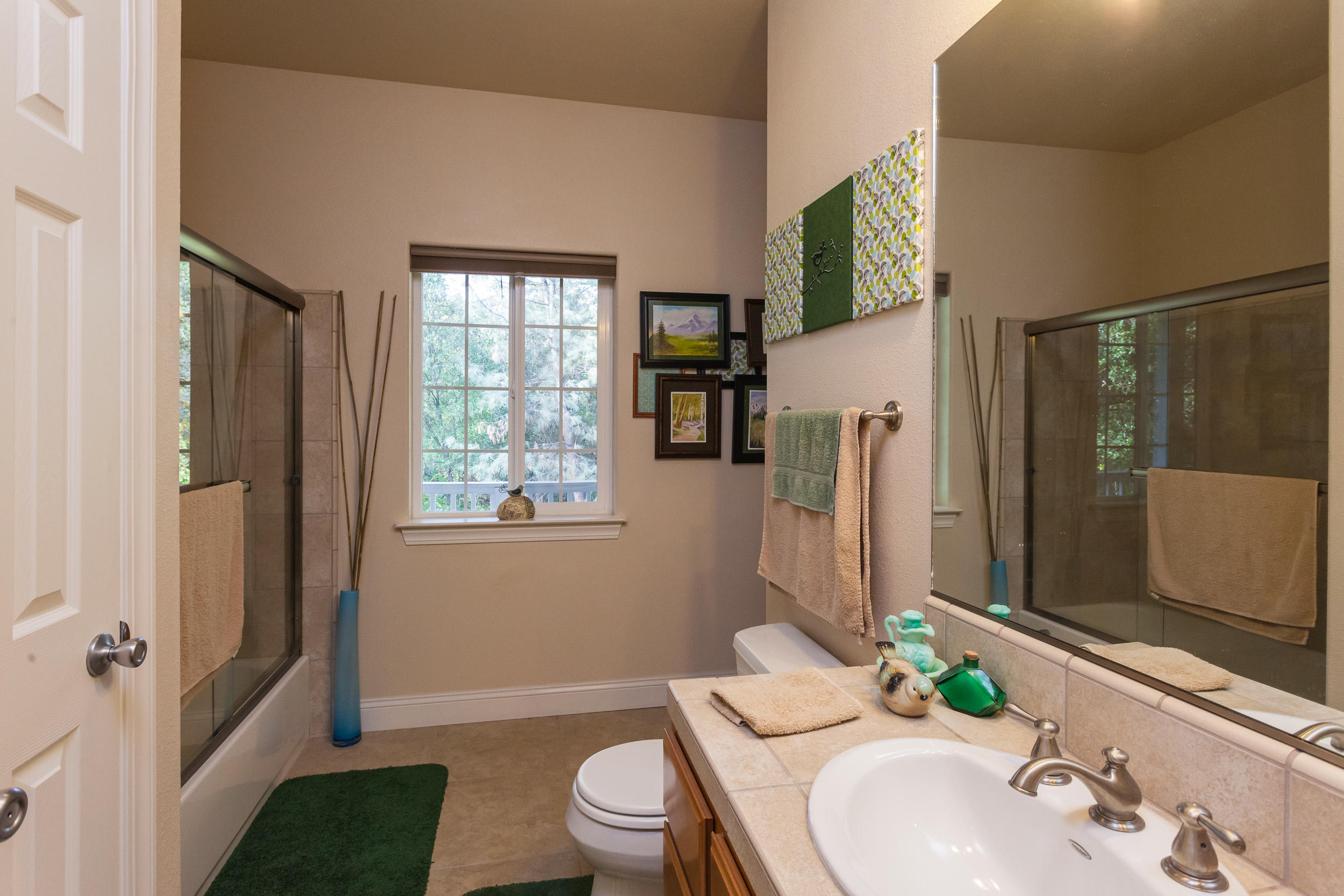 12199 Macs Road Redding, CA 96003 - Photo 25 of 36 a bathroom with a sink toilet and shower a mirror