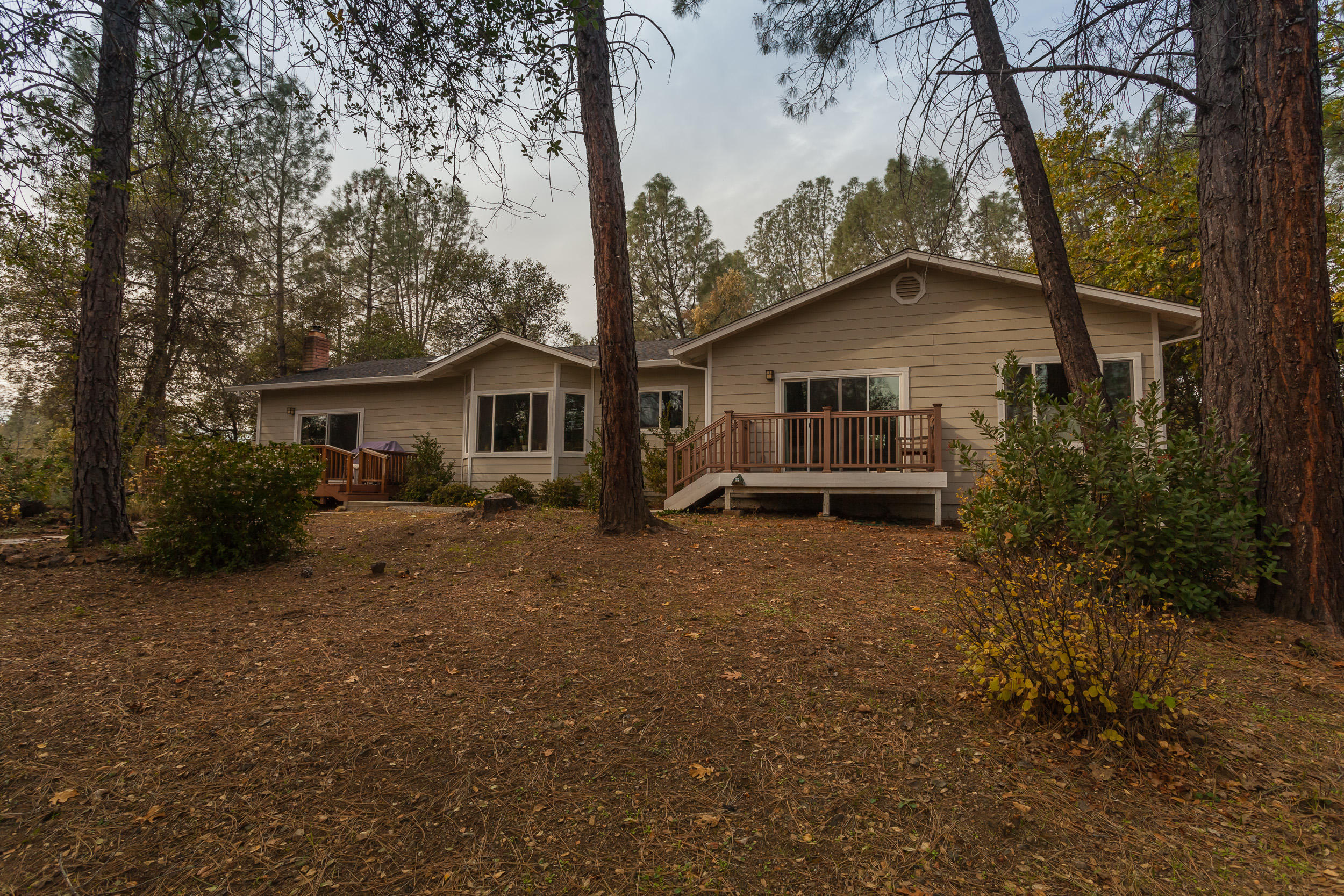 12199 Macs Road Redding, CA 96003 - Photo 33 of 36 a view of a house with a backyard