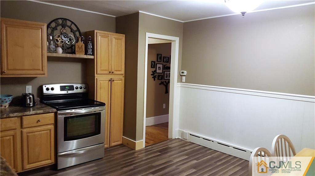 80 Jordan Road Colonia, NJ 07067 - Photo 11 of 21 a kitchen with stainless steel appliances granite countertop a stove and a refrigerator