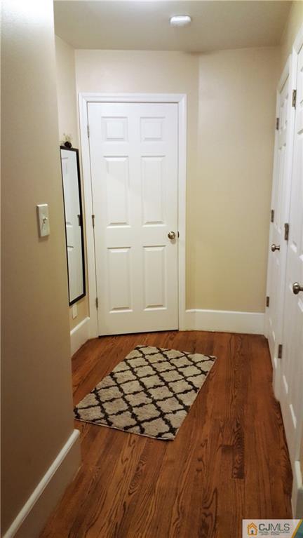 80 Jordan Road Colonia, NJ 07067 - Photo 12 of 21 a view of a room with wooden floor and cabinet