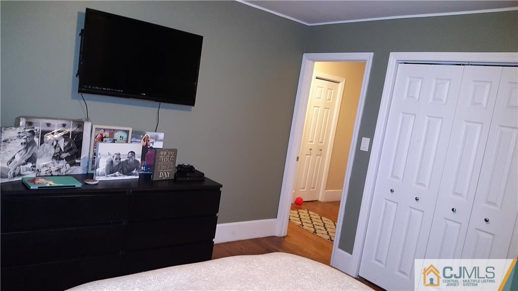 80 Jordan Road Colonia, NJ 07067 - Photo 13 of 21 a living room with furniture and a flat screen tv