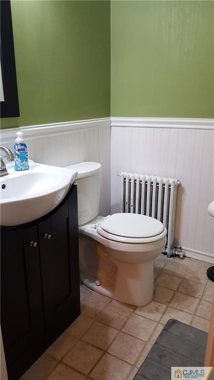 80 Jordan Road Colonia, NJ 07067 - Photo 14 of 21 a bathroom with a toilet sink and mirror