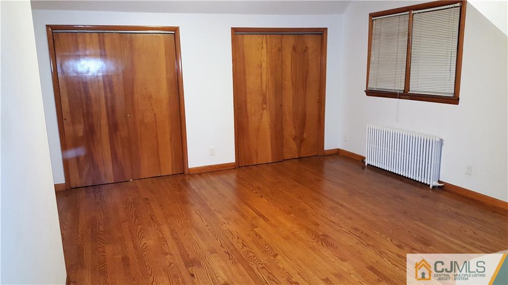 80 Jordan Road Colonia, NJ 07067 - Photo 17 of 21 an empty room with wooden floor and windows