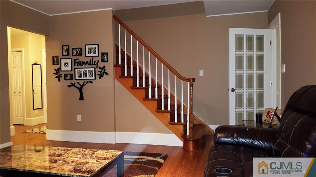 80 Jordan Road Colonia, NJ 07067 - Photo 5 of 21 a view of entryway and hall with wooden floor