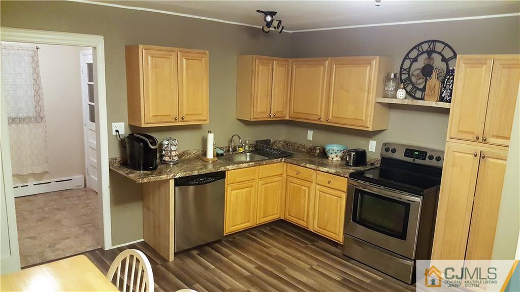 80 Jordan Road Colonia, NJ 07067 - Photo 9 of 21 a kitchen with stainless steel appliances granite countertop a stove and a refrigerator