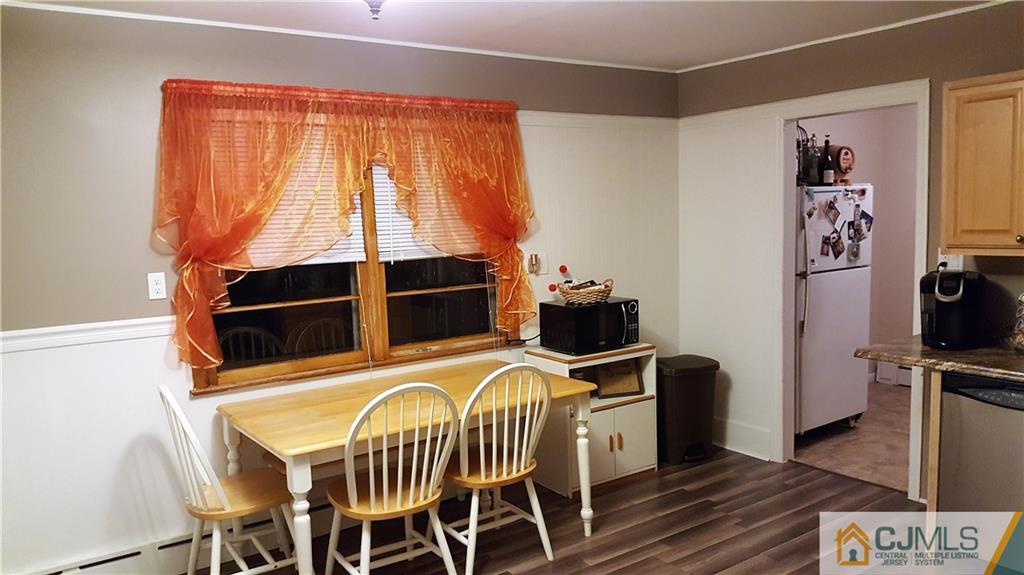 80 Jordan Road Colonia, NJ 07067 - Photo 10 of 21 a view of a dining room with furniture window and wooden floor