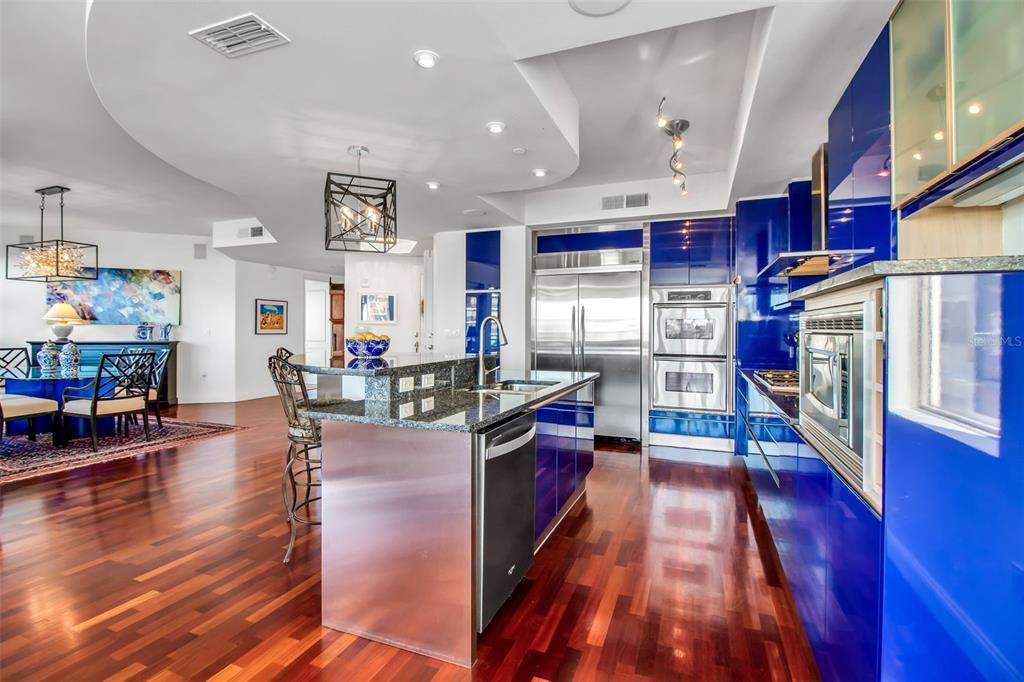 128 Golden Gate Point, Unit 301B Sarasota, FL 34236 - Photo 23 of 34 a kitchen with stainless steel appliances granite countertop lots of counter top space