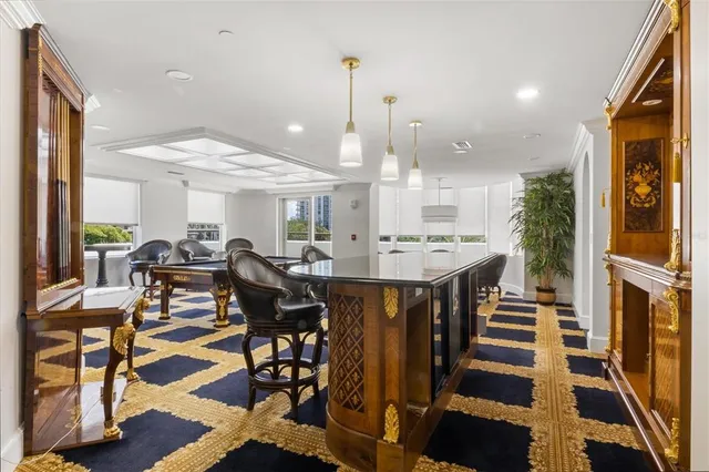 a room with gym equipment and a rug