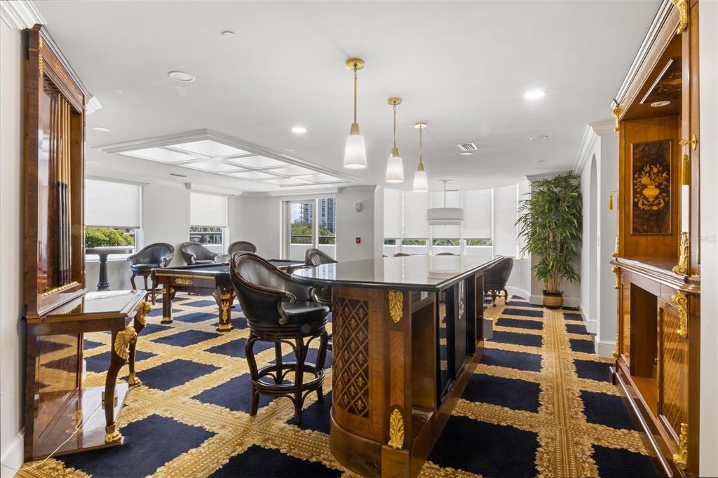 128 Golden Gate Point, Unit 301B Sarasota, FL 34236 - Photo 32 of 34 a view of a a dining room with furniture window and wooden floor
