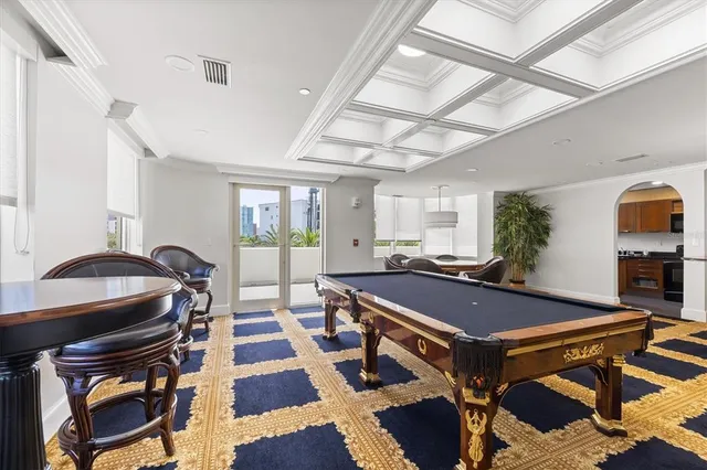 a bedroom with two beds and a flat screen tv