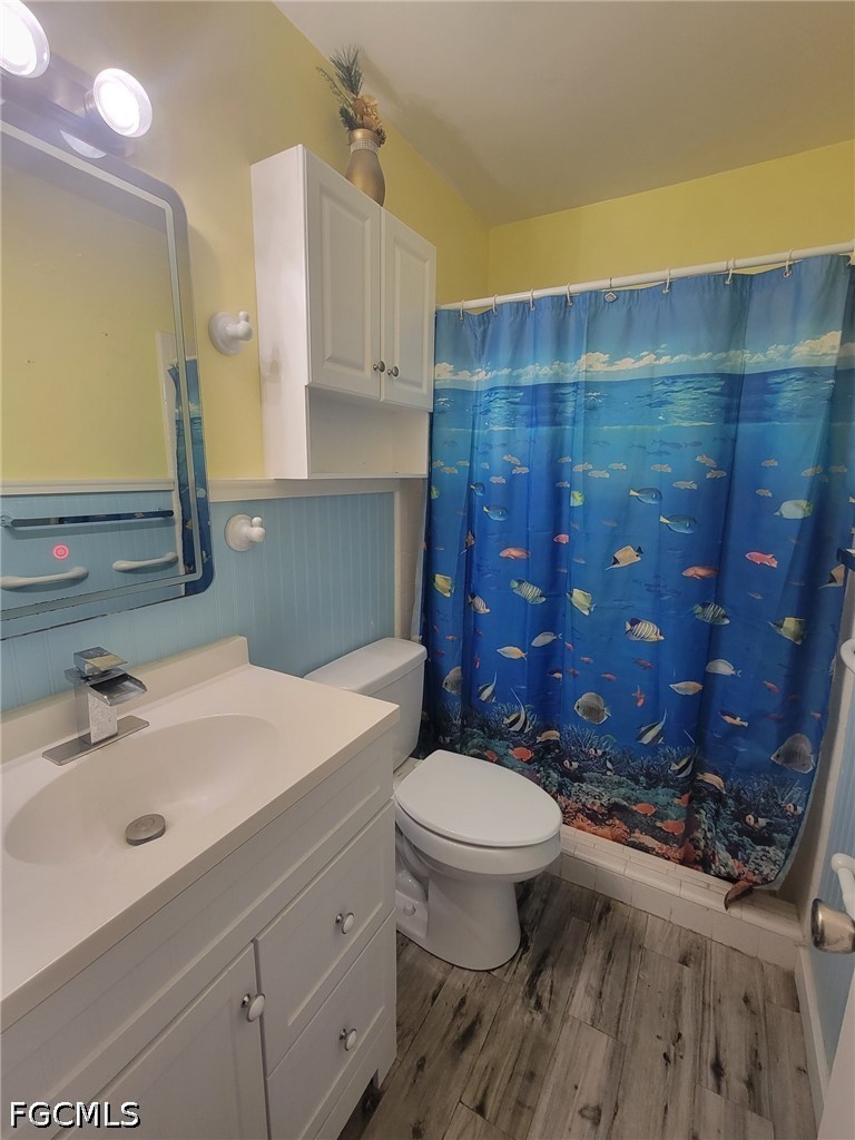 47 Tangelo Court Lehigh Acres, FL 33936 - Photo 11 of 18 a bathroom with a sink a toilet and shower