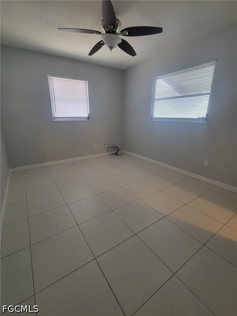 47 Tangelo Court Lehigh Acres, FL 33936 - Photo 14 of 18 a view of an empty room with a window