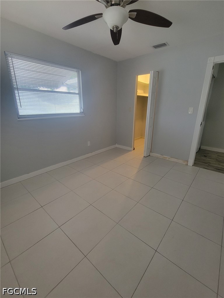 47 Tangelo Court Lehigh Acres, FL 33936 - Photo 15 of 18 a view of an empty room with a window