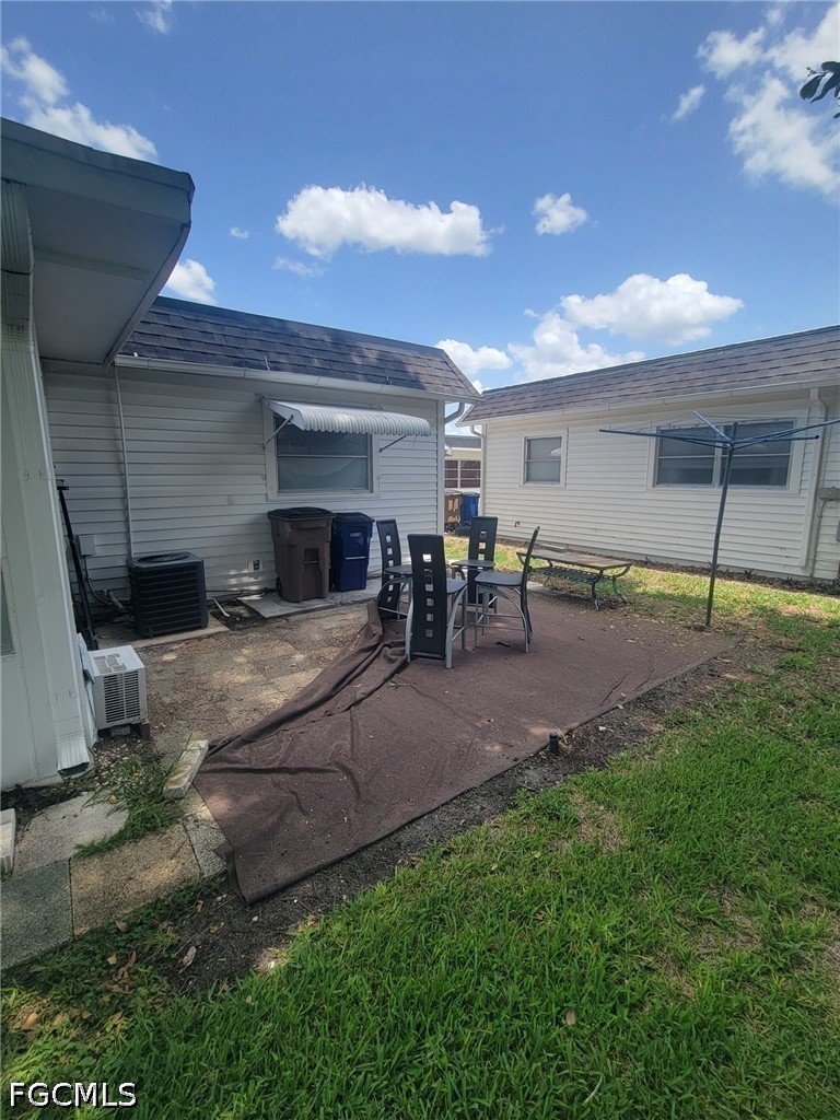 47 Tangelo Court Lehigh Acres, FL 33936 - Photo 17 of 18 a view of a backyard of a house