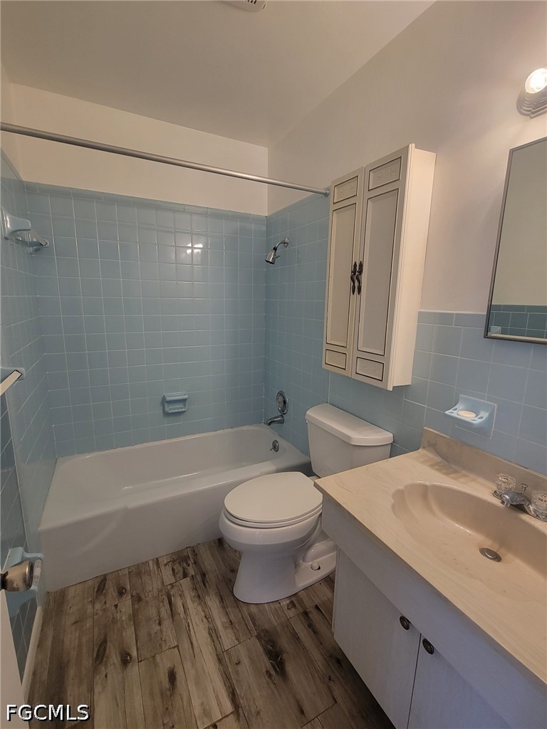 47 Tangelo Court Lehigh Acres, FL 33936 - Photo 9 of 18 a bathroom with a sink toilet a mirror and shower