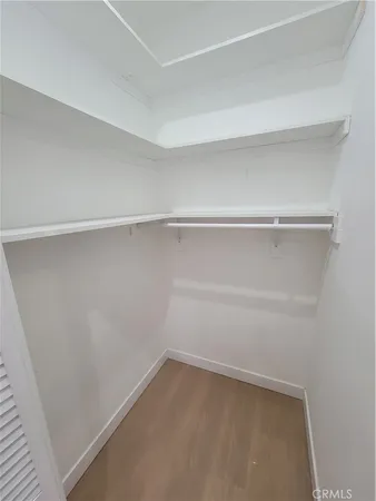 a view of an empty walk in closet