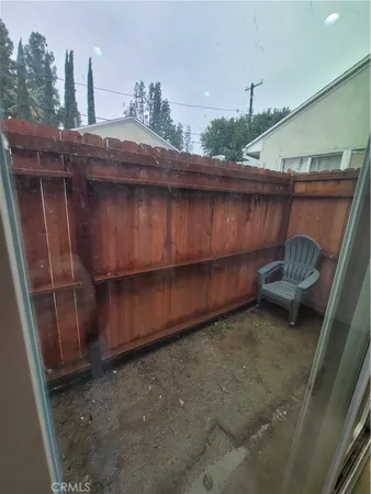 a view of a kitchen with furniture and window