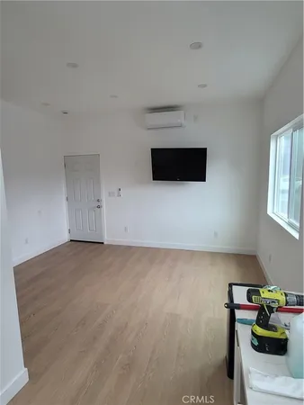a kitchen with a refrigerator stove and white cabinets