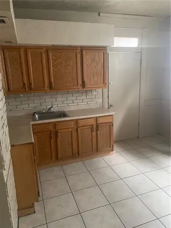 a kitchen with a sink and cabinets