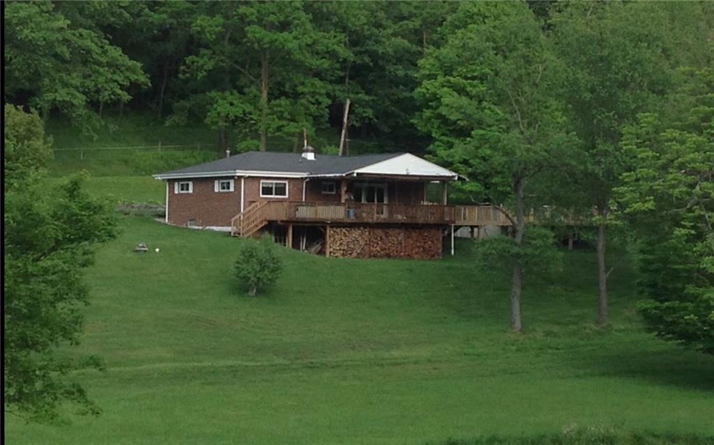 View of home from surrounding acreage